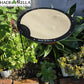 A Circle Shade-A-Rella adjustable plant umbrella by Shade-A-Rella is set up among green succulents in a garden, providing partial shade.