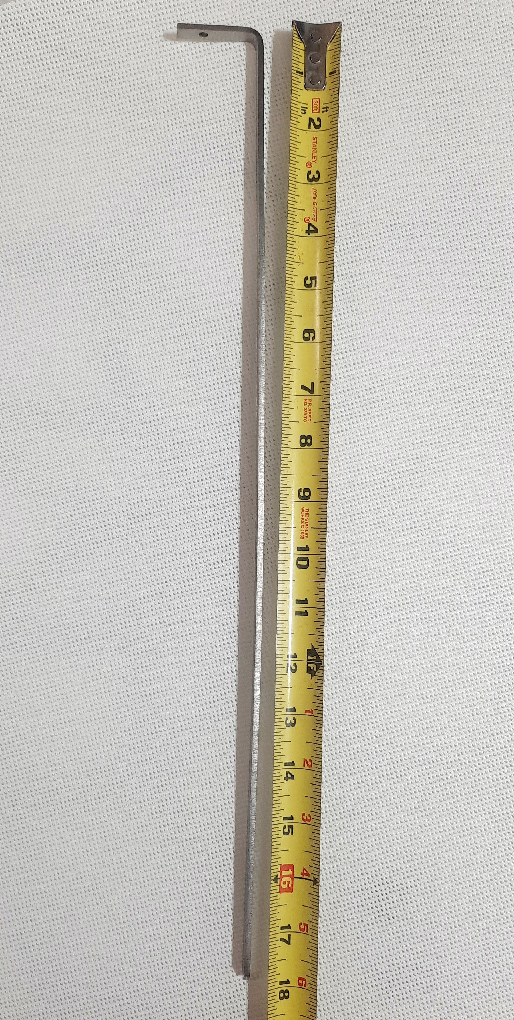 The Shade-A-Rella 7.5-inch small Flower with red frame and dark green 95% shade cloth is shown next to a measuring tape on a light textured background, highlighting its size and suitability for plant shading.